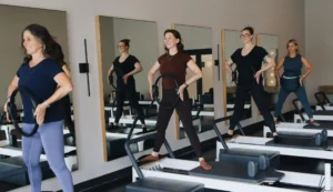 Women enjoying a free intro to Pilates group reformer class at Right Balance Pilates in Rehoboth Beach Delaware