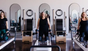 Right Balance Pilates pricing update with women in a group reformer class