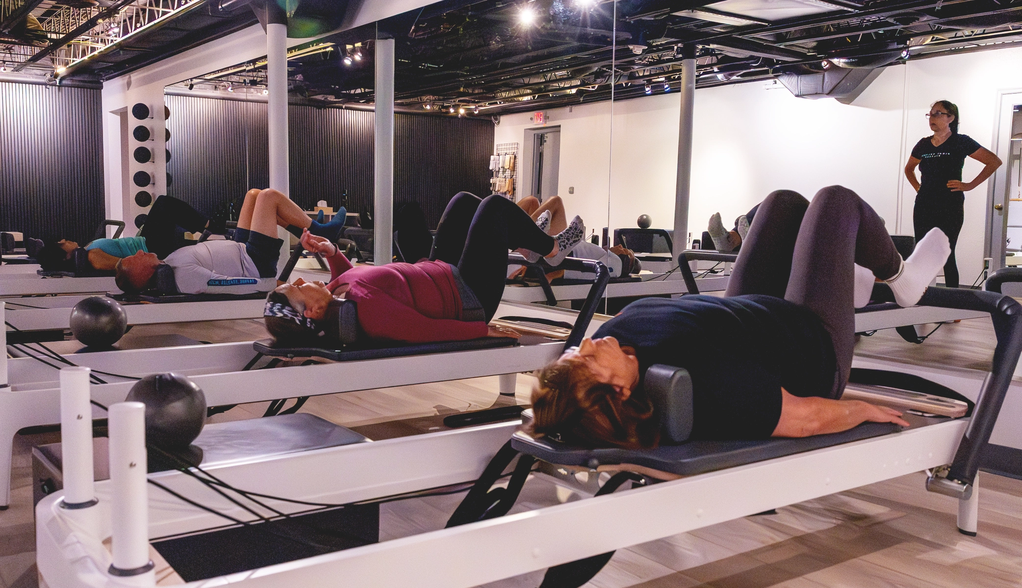 Pilates for seniors core exercise with a Right Balance Pilates instructor on reformer