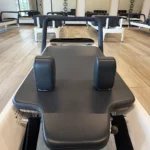 Ergonomic shoulder rests and adjustable headrest on an Allegro 2 Reformer carriage